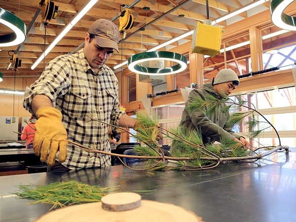 Brodersen (left) works with students at the laboratory at Yale-Myers Forest.