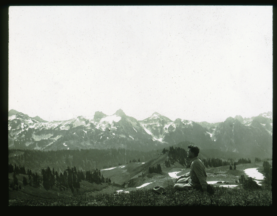 A forester relaxes in Mount Rainier National Park, Washington, in the early 1900s. Credit: Yale University Lantern Slide Collection