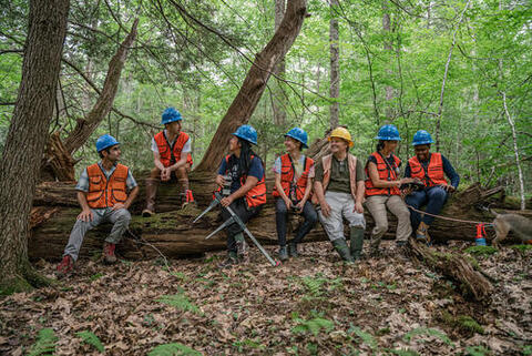 Joe Orefice (far left) and Mark Ashton (yellow helmet) instruct the 2022 Forest Crew on timber marking in Yale-Myers Forest on July 21, 2022. Photo courtesy of Ian Christmann.