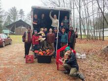 Foresters and their dogs measure, cut, bail, and load Christmas trees at Yale-Myers Forest to bring back down to Marsh Hall for their annual sale and fundraiser. Photo by Rich Dezso, QCI participant.