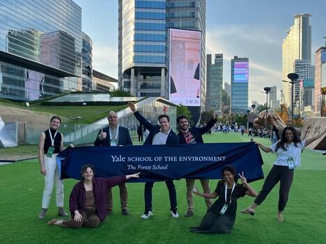 Students and staff, posing outside of the convention center, represent The Forest School at the Yale School of the Environment at the 2022 World Forest Congress in Seoul, South Korea. 